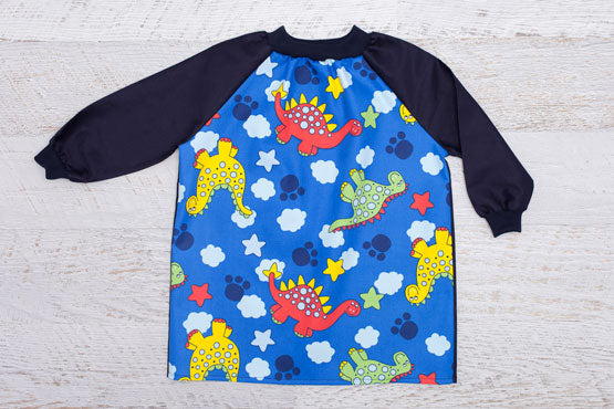 Dinosaur art smock with long navy sleeves