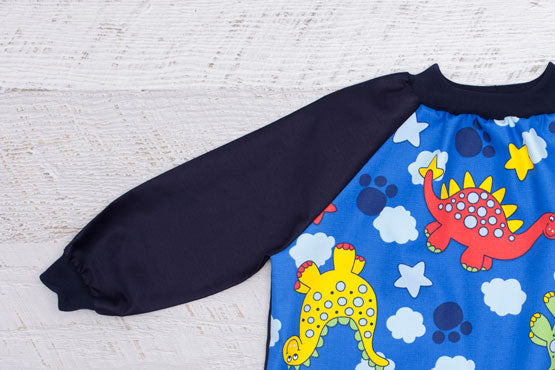 Dinosaur art smock with long navy sleeves