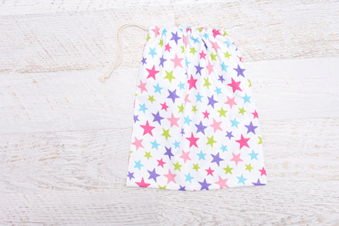 Large drawstring Library Bag which features coloured stars on white background
